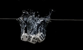 white and black polka dot ceramic mug with water