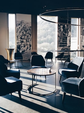 A stylish lounge area with monochrome decor and soft ambient light.