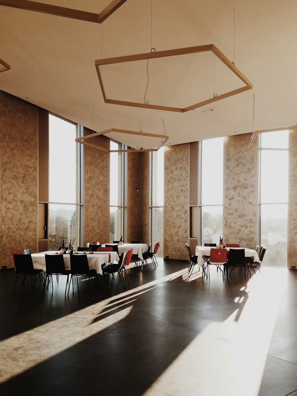 white and black chairs and tables inside room