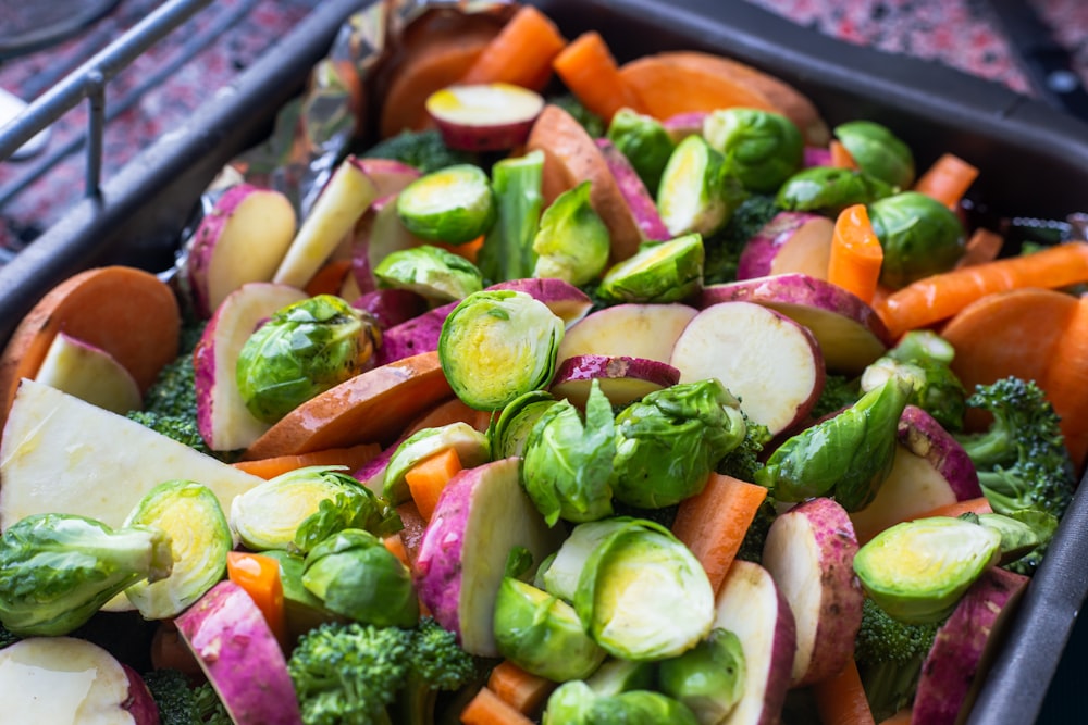 sliced vegetables on black plastic container