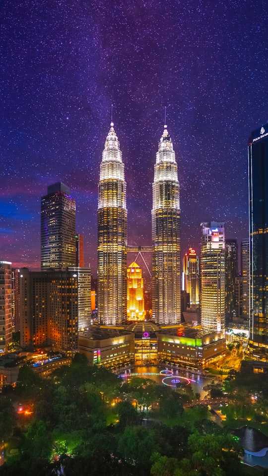 city buildings during night time in KLCC Park Malaysia