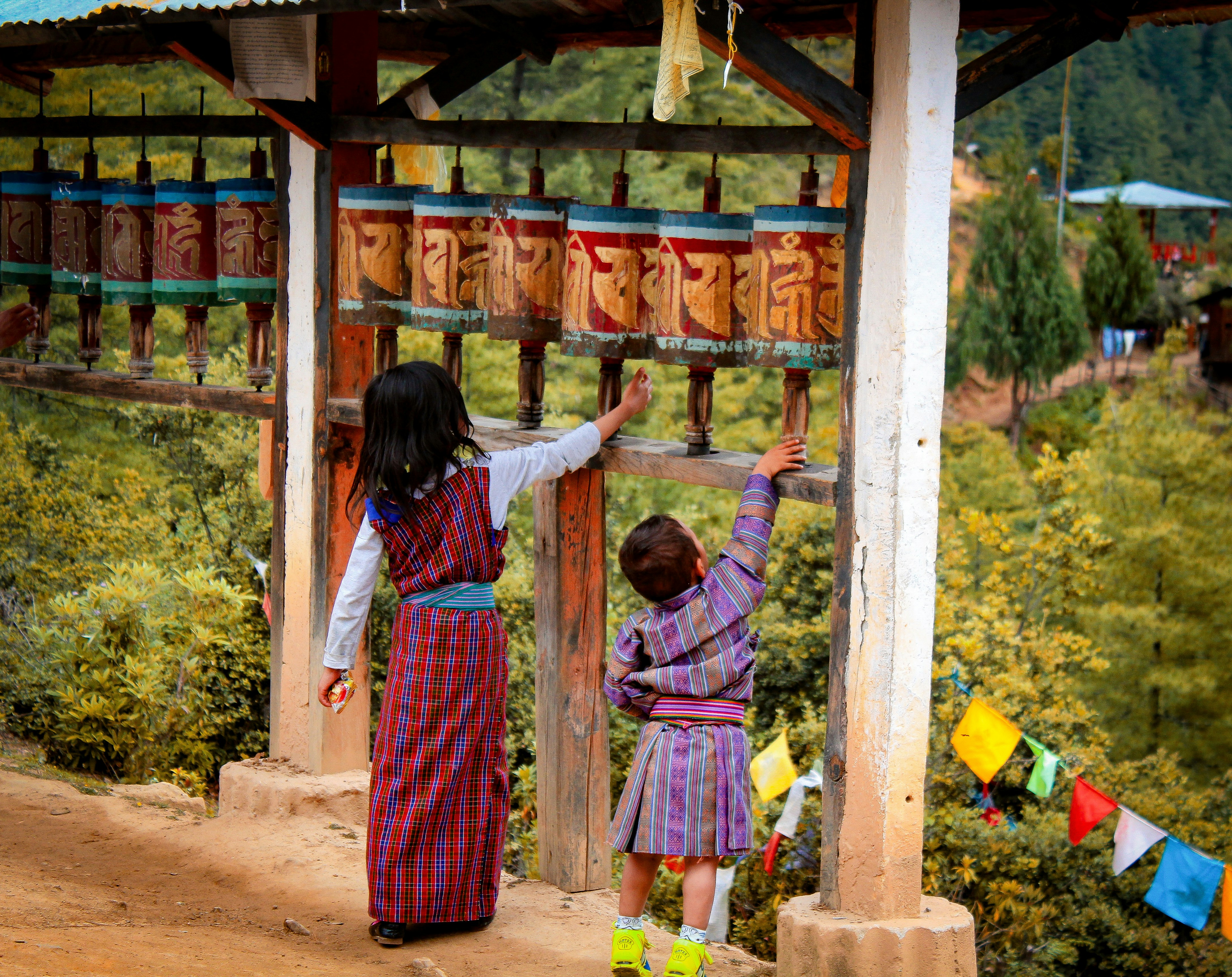girl in pink dress standing beside girl in pink dress