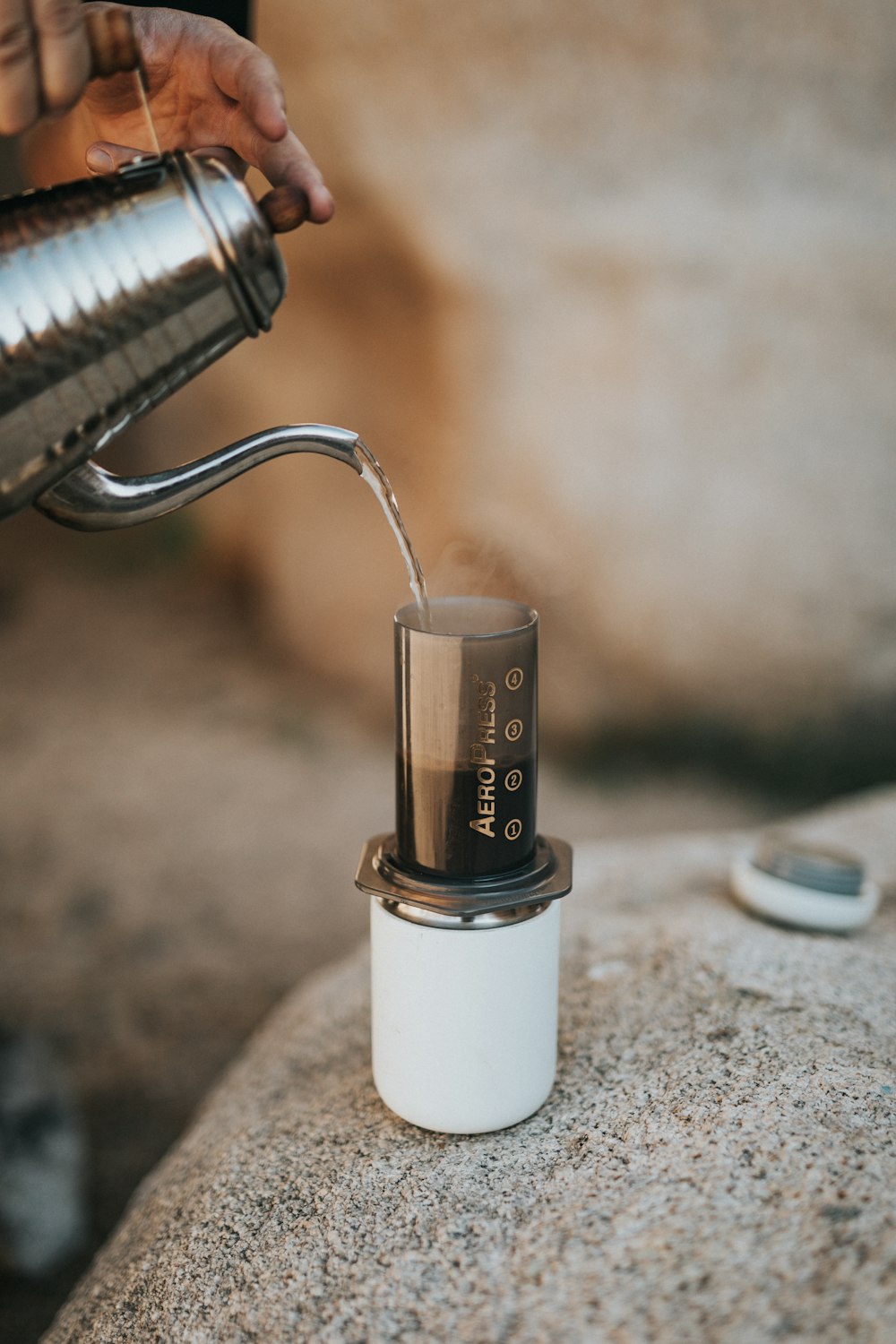 silver and white tube type vape