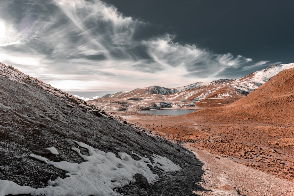 brown and white mountains under blue sky during daytime