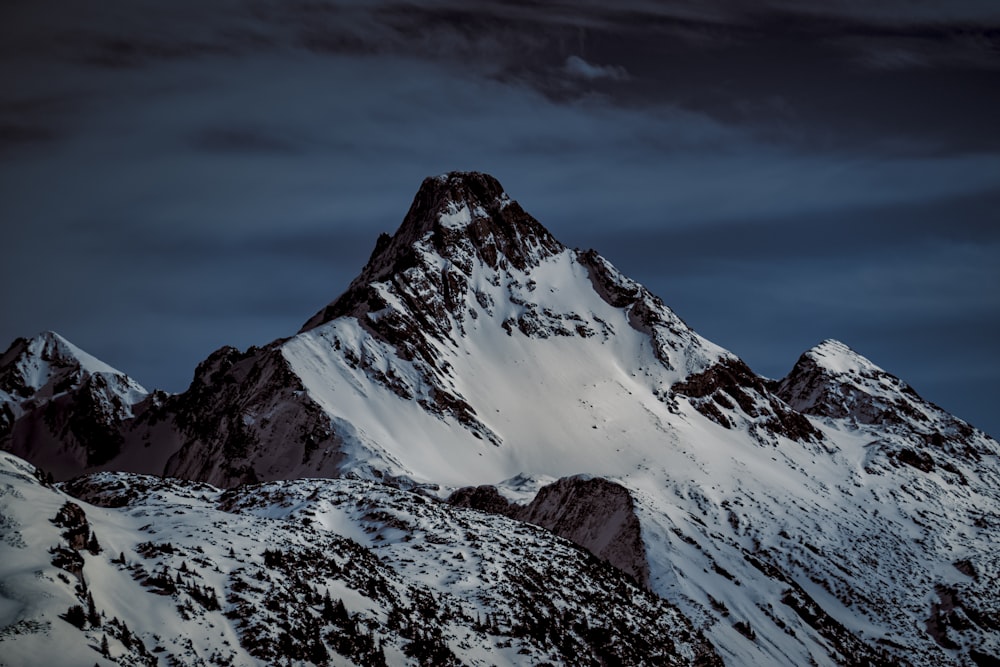 snow covered mountain under blue sky during daytime