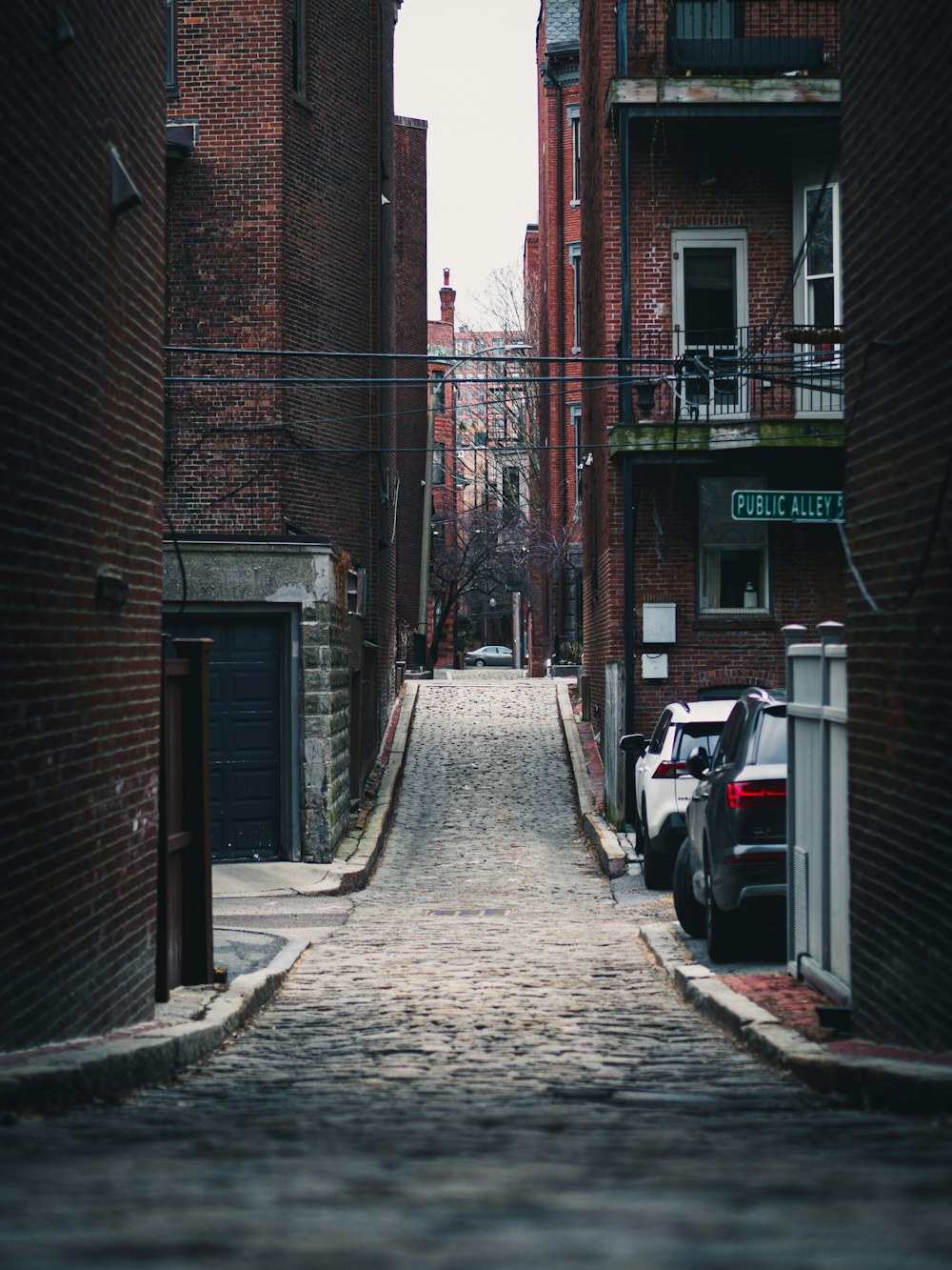 brown brick building with black steel gate