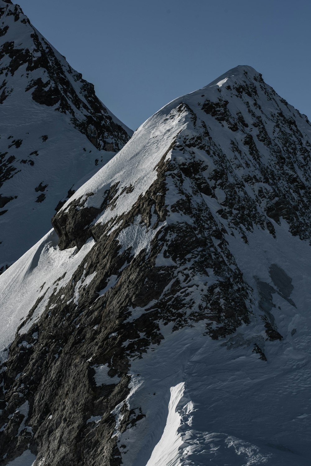 snow covered mountain during daytime