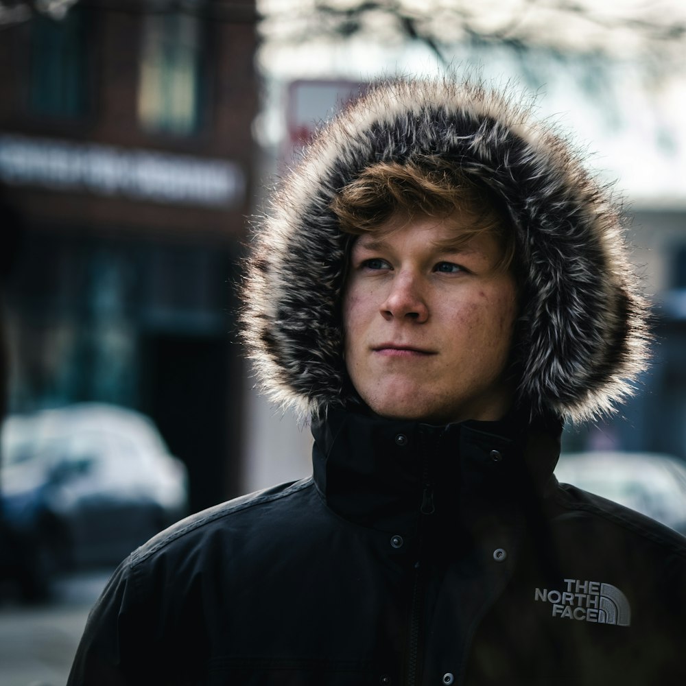 man in black and brown parka jacket