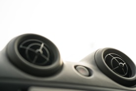 Close-up of air conditioning vents with cool airflow