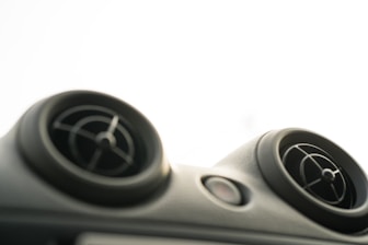 Close-up of air conditioning vents with cool airflow