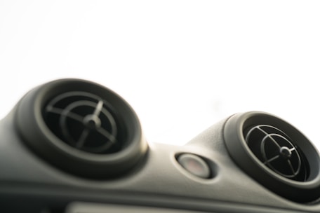 Close-up of clean air vents with visible airflow in a professional workspace.