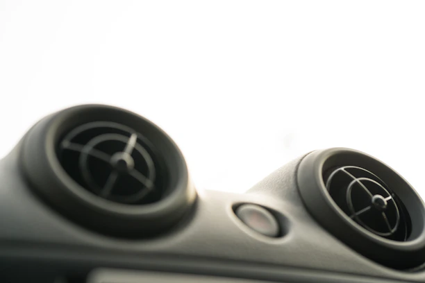 Close-up of air vents before and after professional cleaning, showing clear improvement.