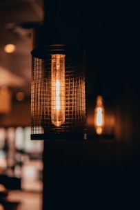 Decorative pendant light casting warm glow over a stylish living space.