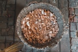 Wood shavings displayed in a barn setting.