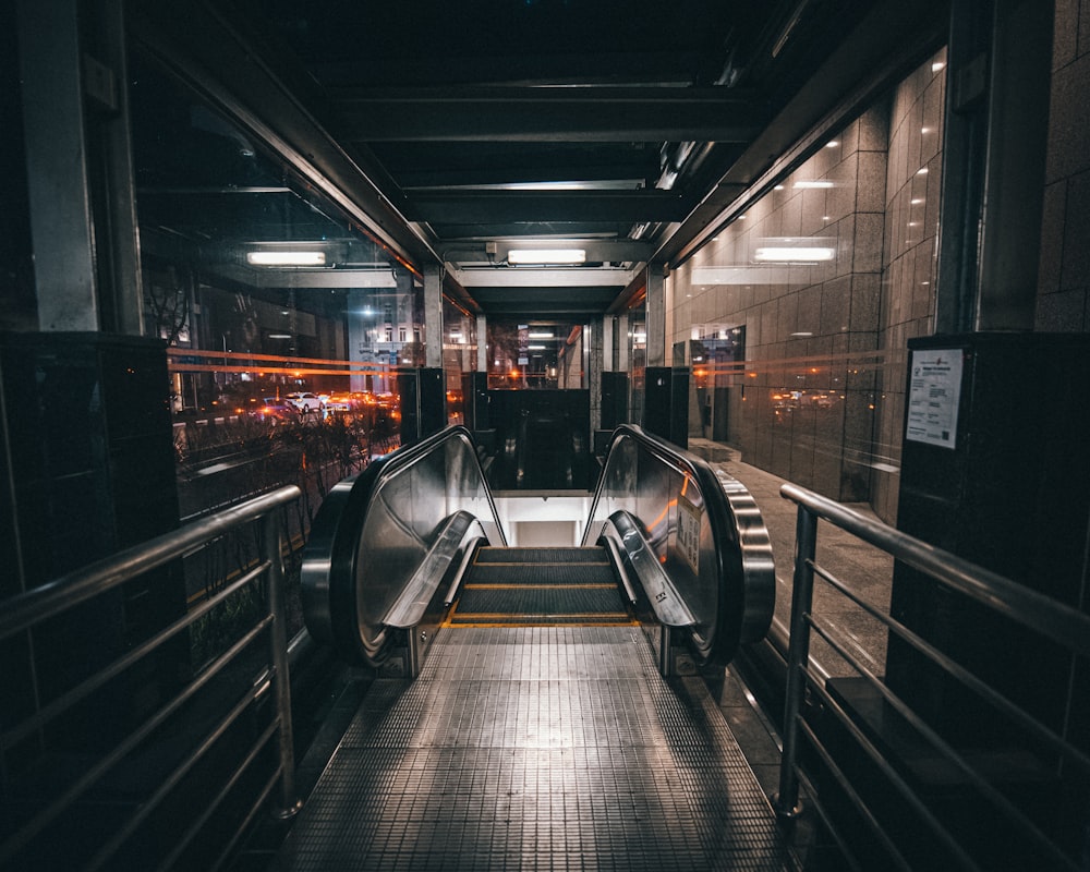 black escalator in a train station