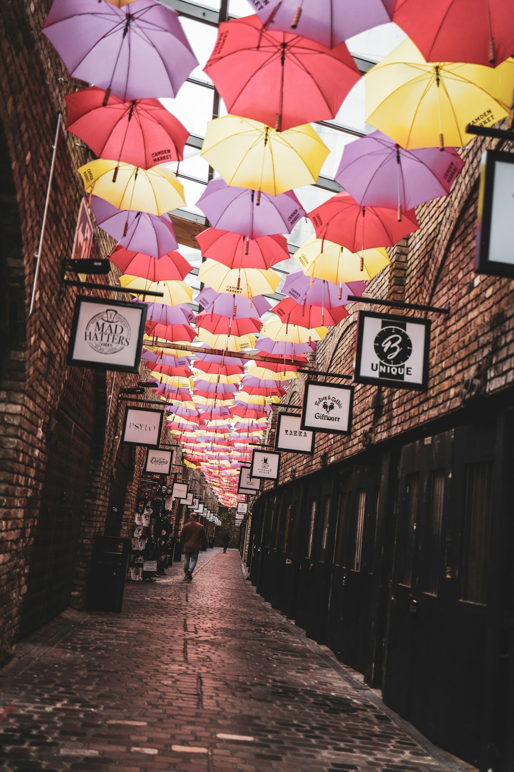 umbrella hanging on wall during daytime