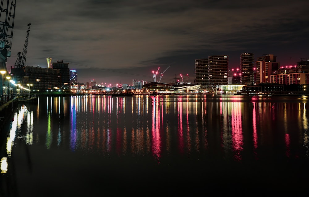 a large body of water with a city in the background