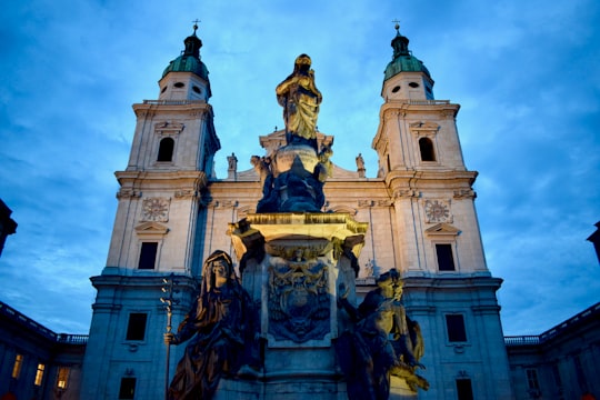 gold and white concrete building in Salzburg Cathedral Austria