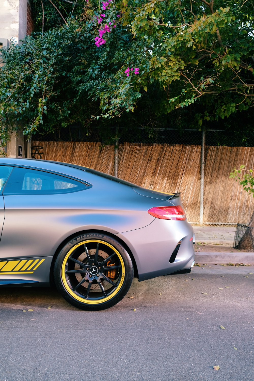 blue bmw m 3 coupe parked on gray concrete pavement