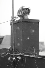 An image depicting a technician performing maintenance on HVAC equipment.