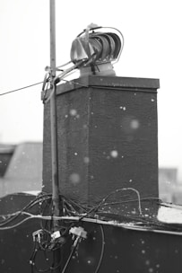 A sleek black and white image of a home inspection in progress.