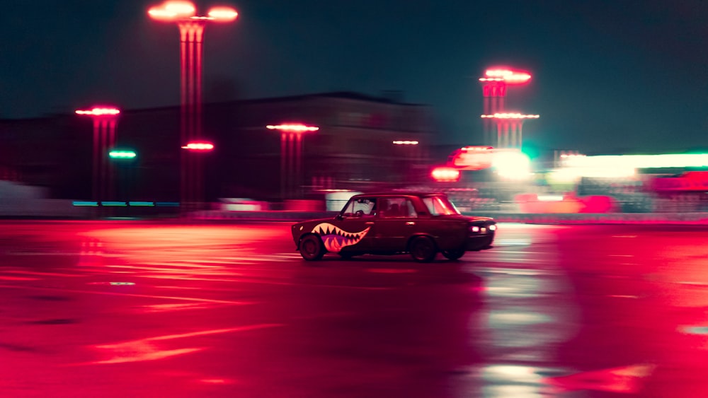 black sedan on road during night time