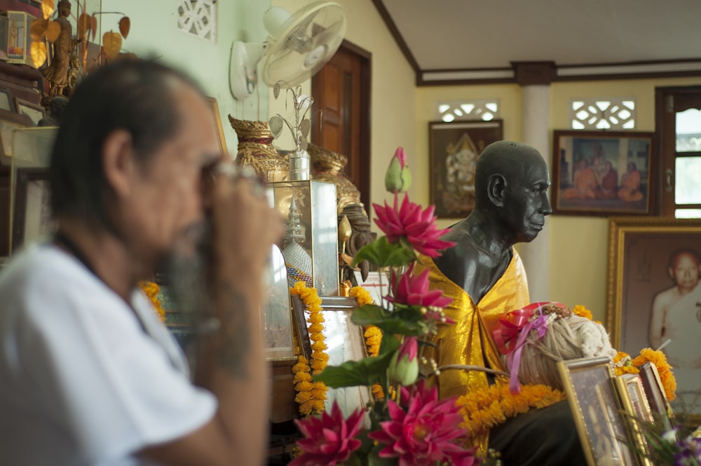 man in white shirt sitting beside woman in white shirt