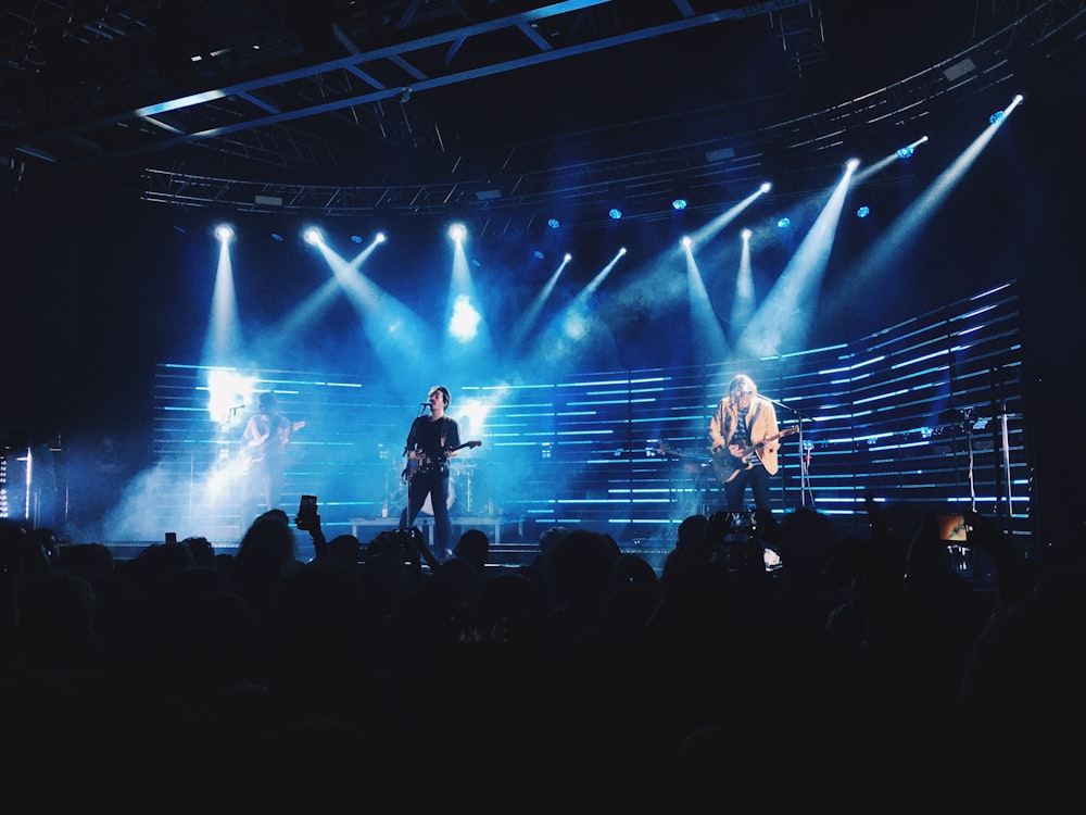 a group of people standing on top of a stage