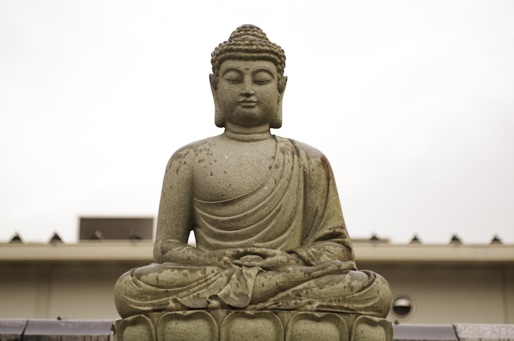 gray concrete statue of a man