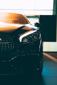 A close-up of a luxury car at an auction event.
