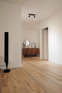 black tower speaker beside white wall