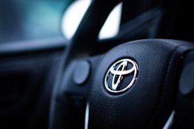 black toyota car steering wheel