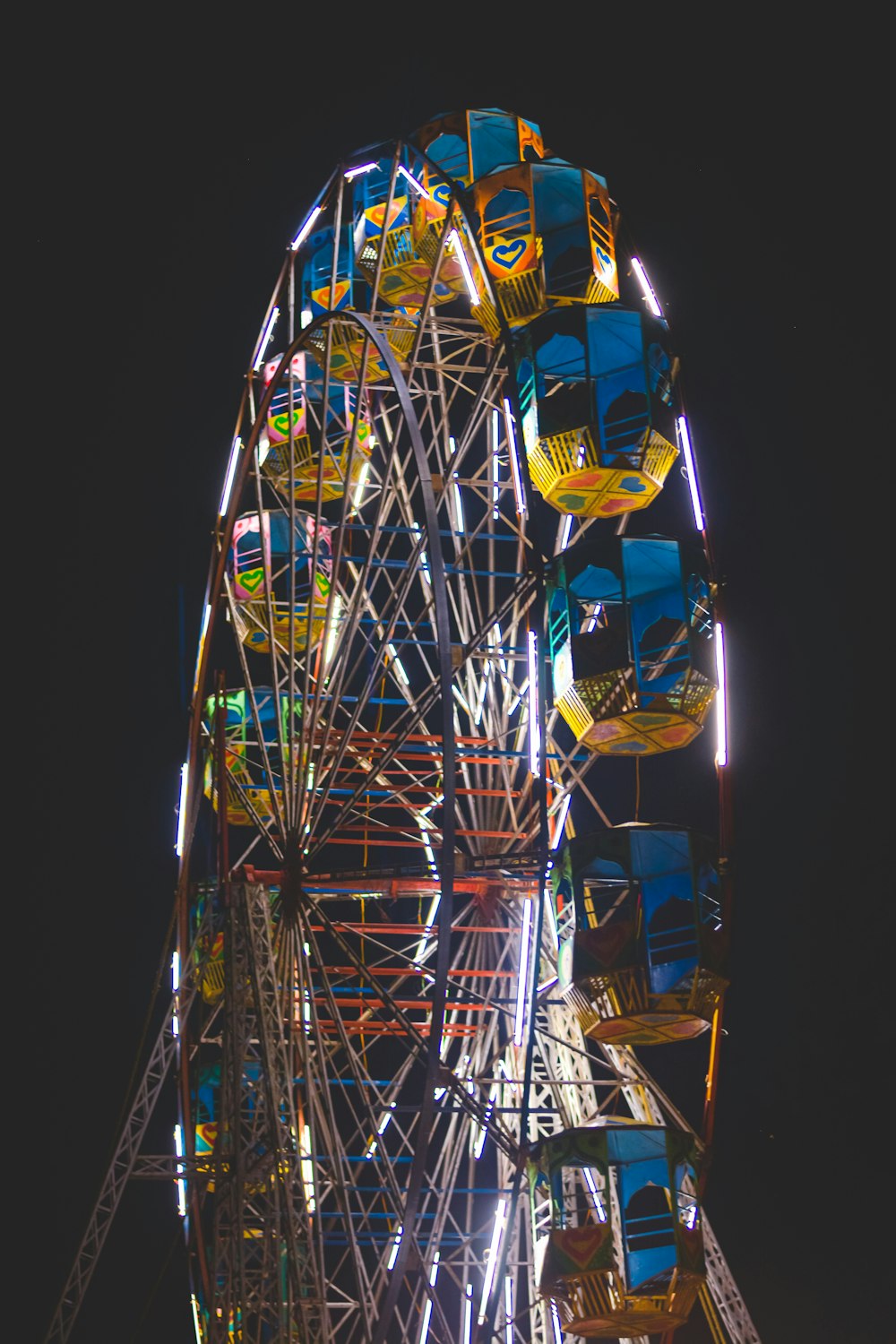 yellow and blue ferris wheel during night time