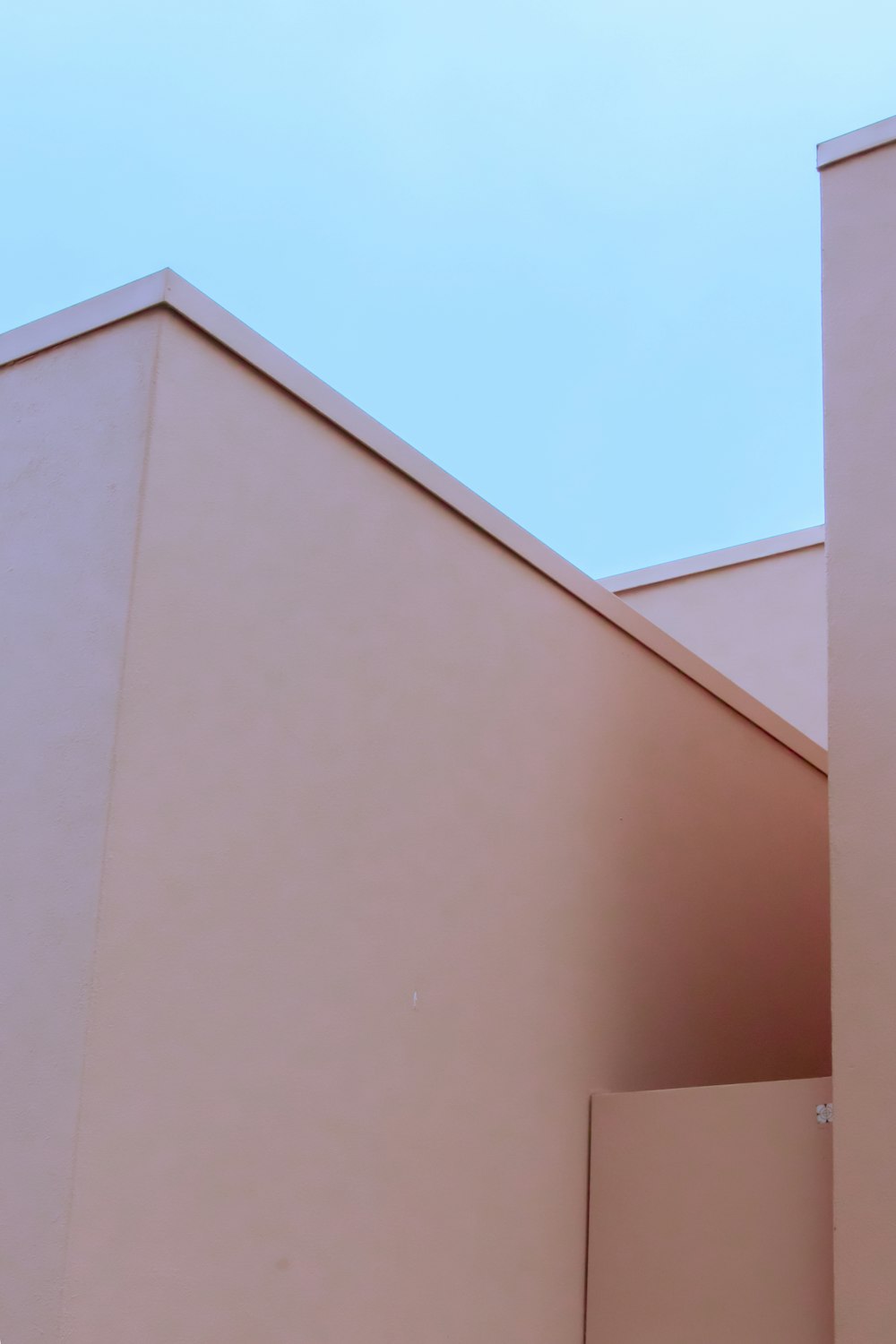 white concrete building under blue sky during daytime