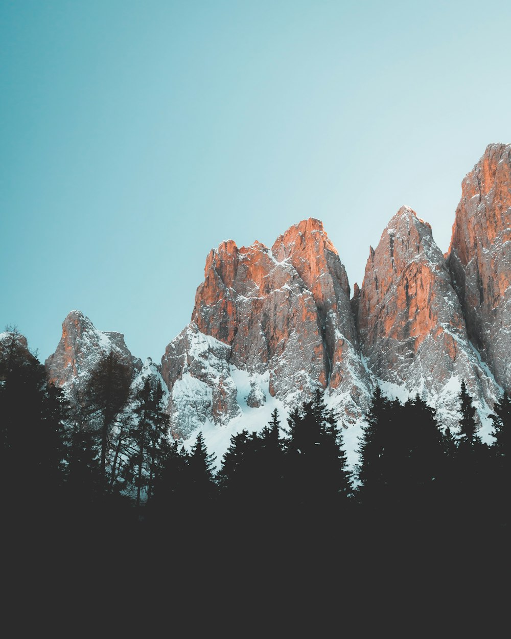 brown rocky mountain under blue sky during daytime