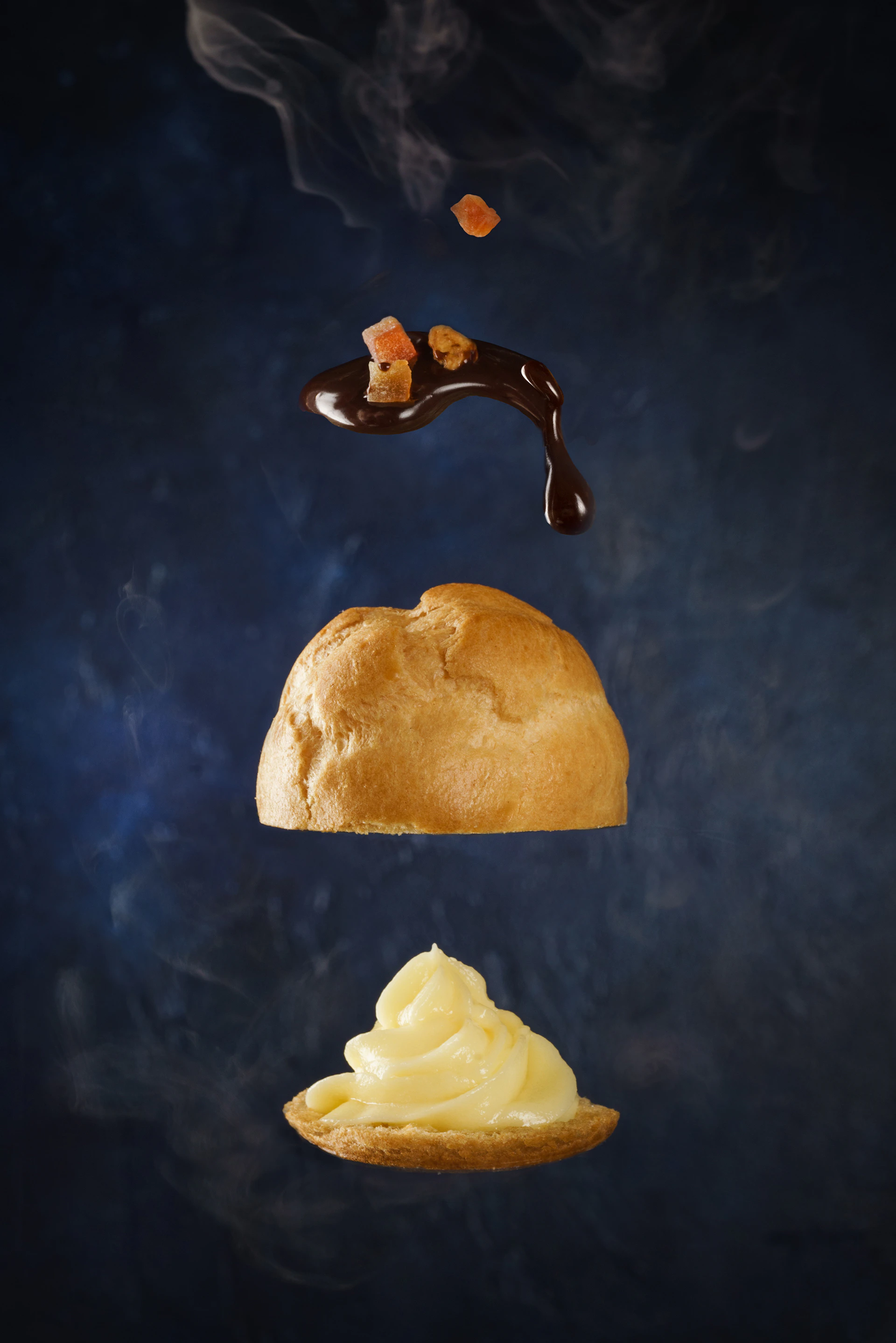 burger with brown syrup on black surface