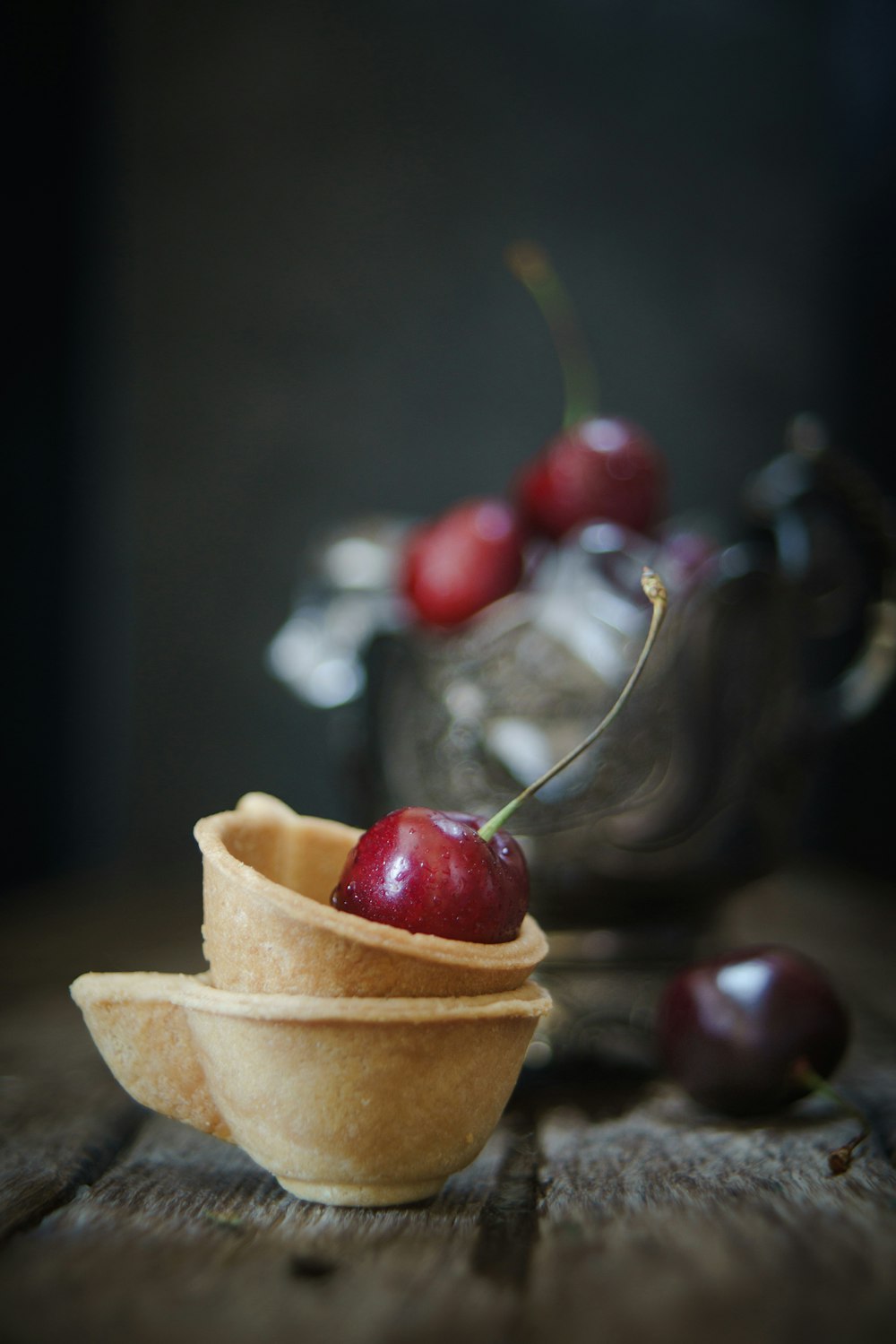 red cherries on brown paper