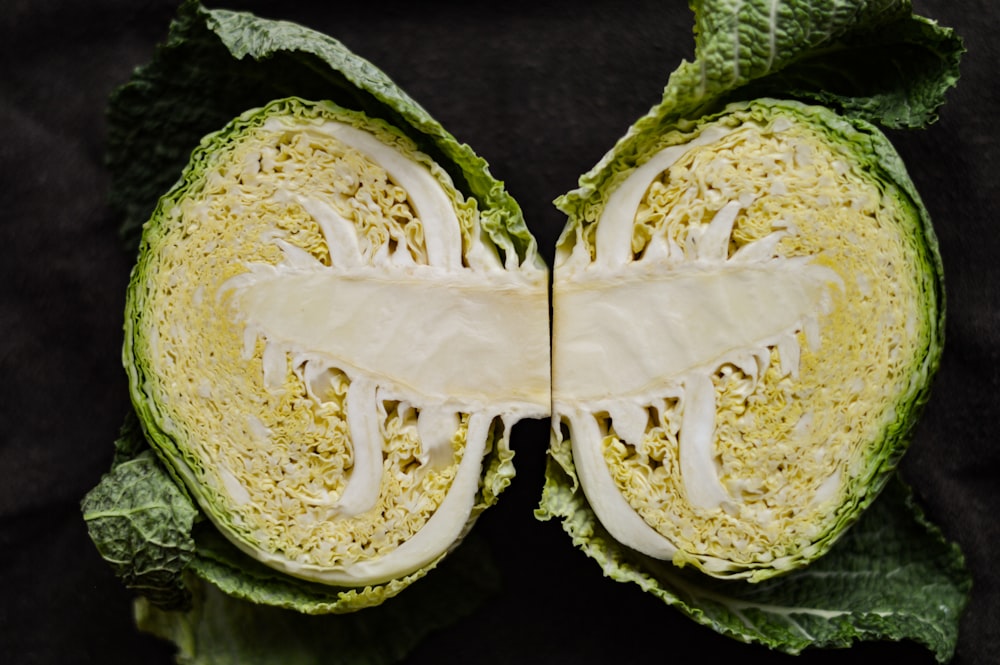 sliced green vegetable on black textile