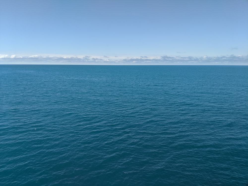 blue sea under blue sky during daytime