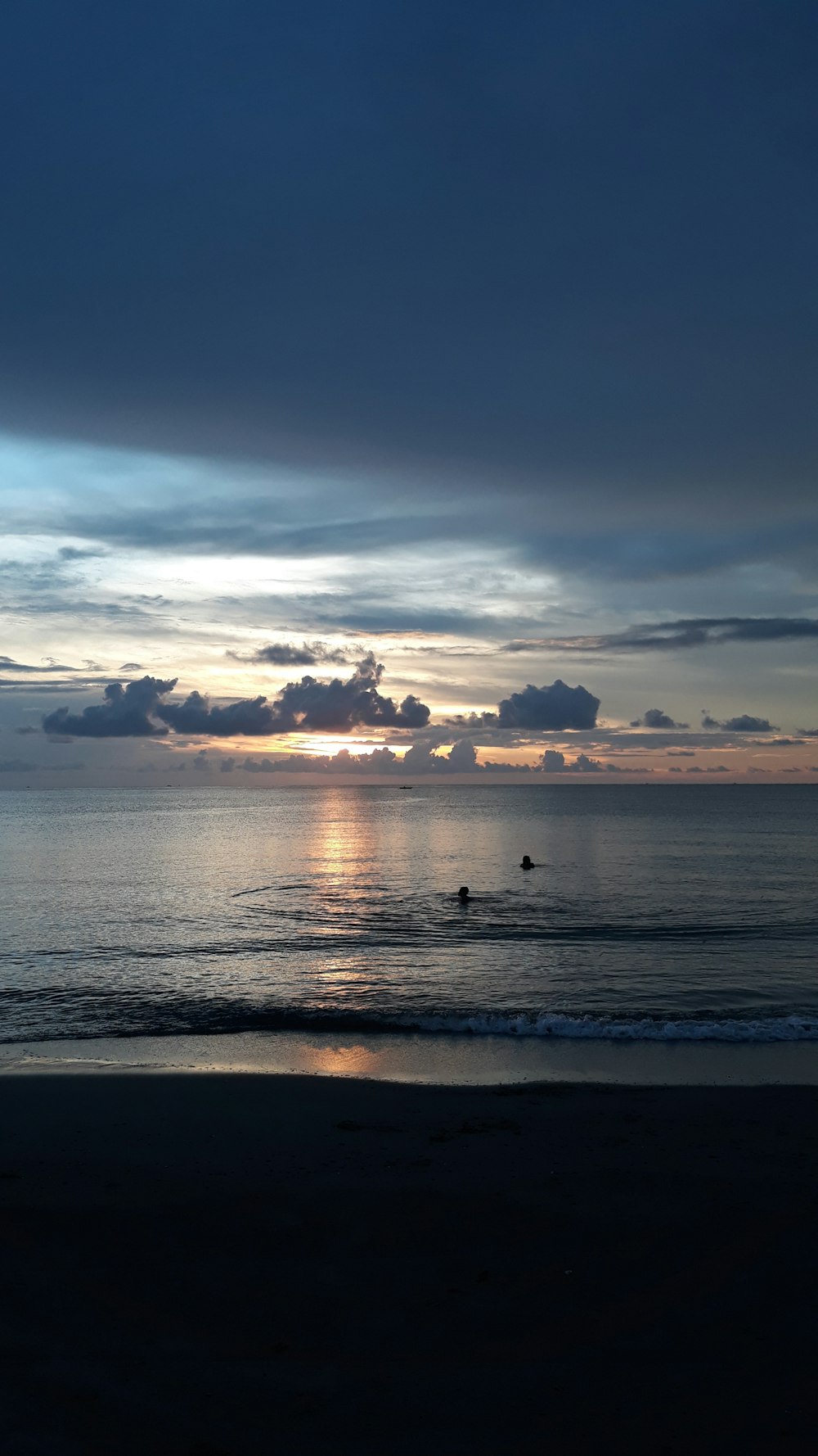 body of water under cloudy sky during daytime