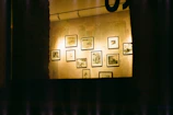 Subtle lighting illuminating a storyboard pinned on a gallery wall.
