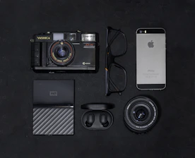 An elegant flat lay of vintage maps and modern digital devices symbolizing history and technology.