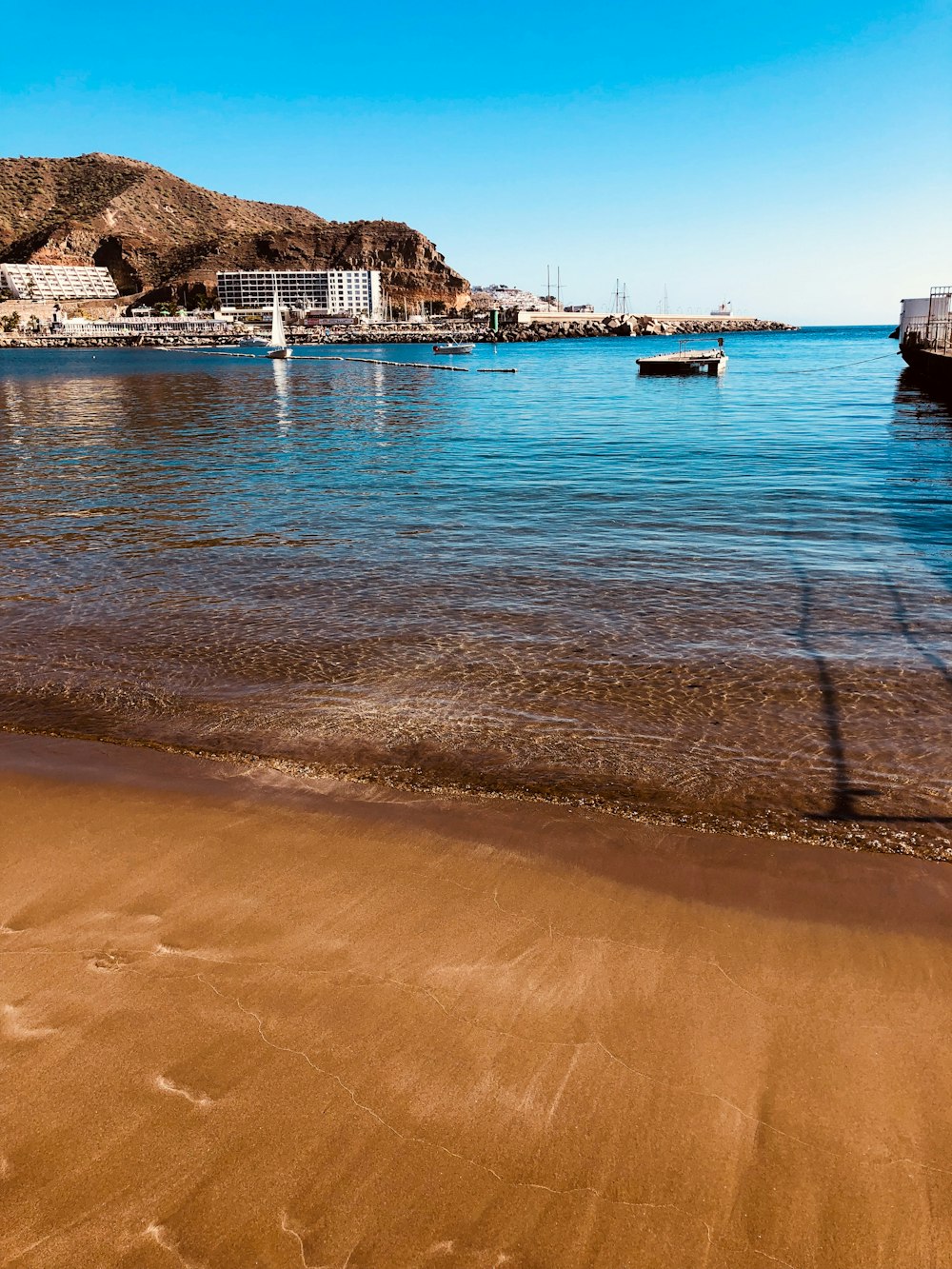 white and blue boat on sea during daytime