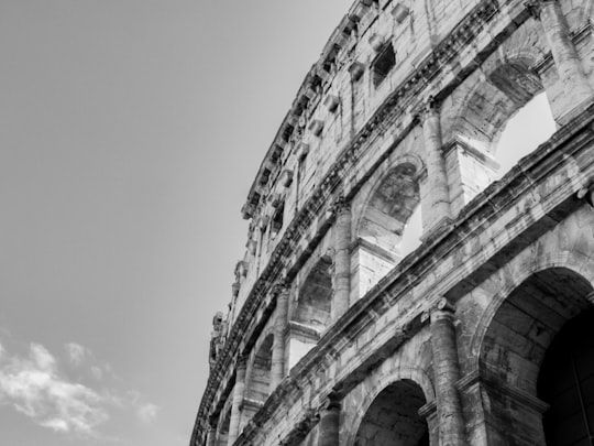 grayscale photo of concrete building in Colosseum Italy