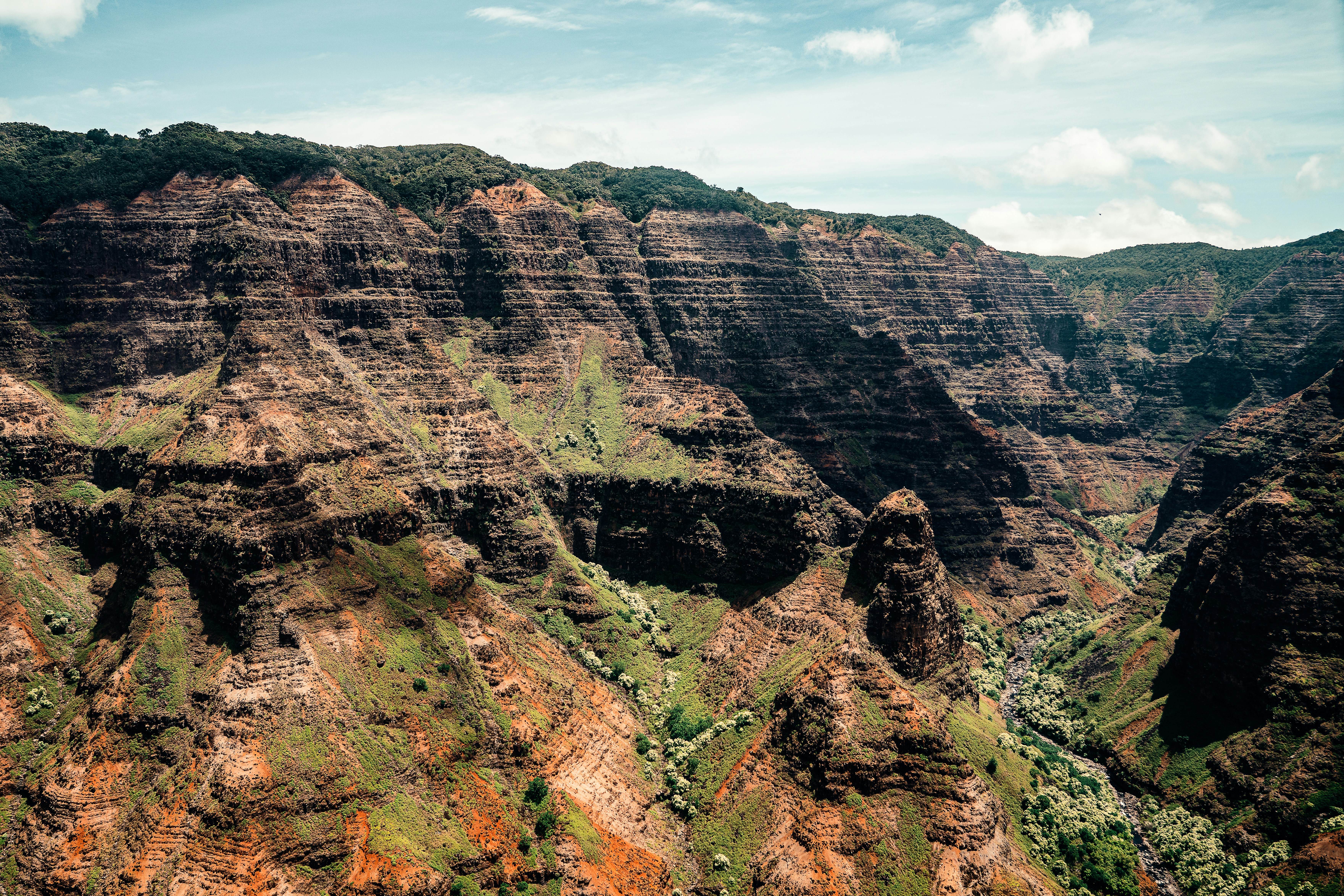 brown rocky mountain under blue sky during daytime, I hope you like the photo! If you do, please leave a like. Feel free to check out my commercial food + hotel photography here on my other account: sebastiancoman and visit my website to get in touch with me: sebcoman.com
