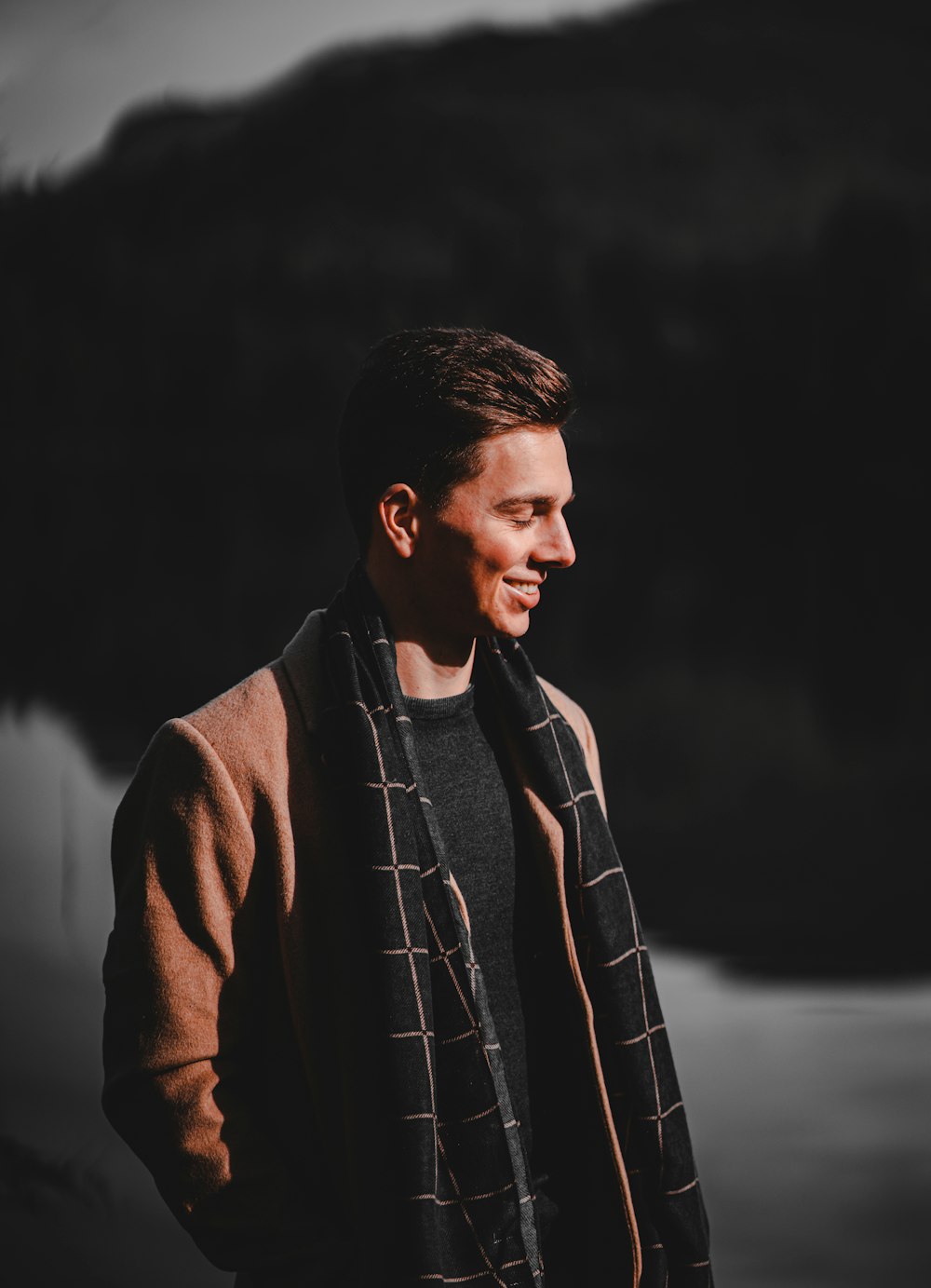 man in brown coat standing