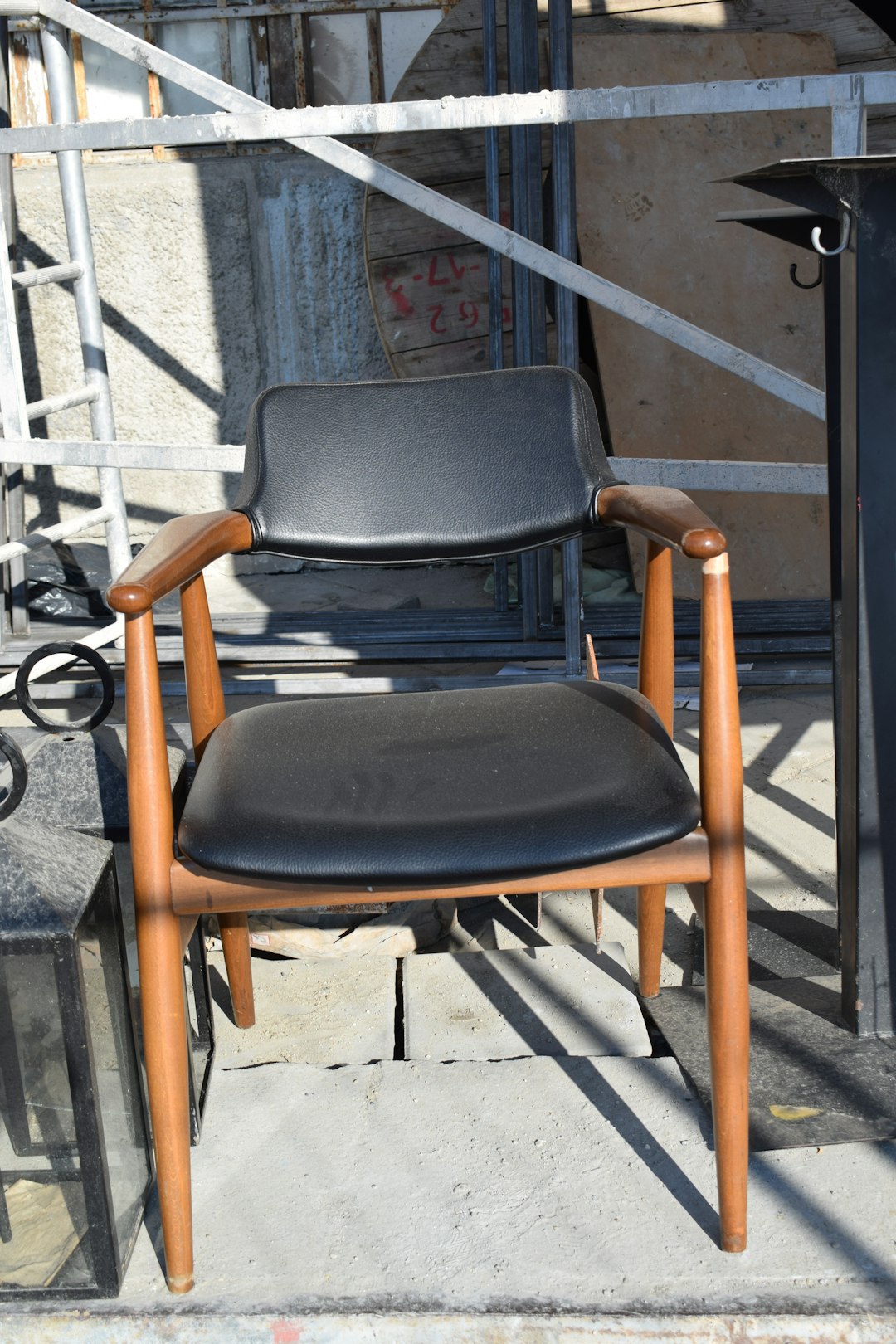 black and brown wooden armchair