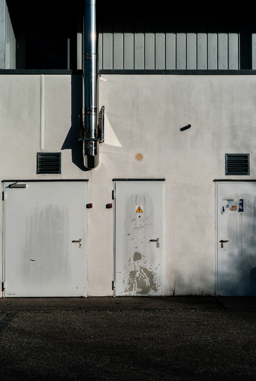 white and black building with white wall