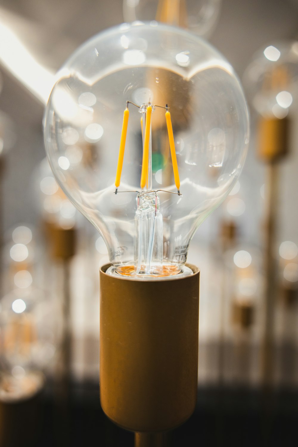 clear drinking glass with yellow liquid and straw