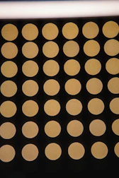 Visual pixel grid heatmap glowing softly with amber and cyan nodes linked to user profiles.